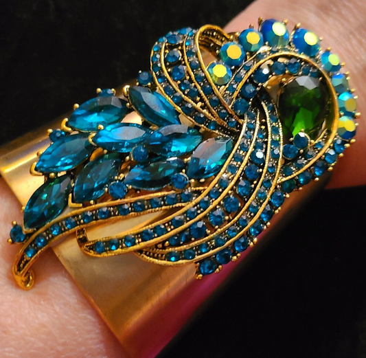 Blue Green Aurora Borealis Rhinestone Jewel on a Wide Gold Tone Cuff